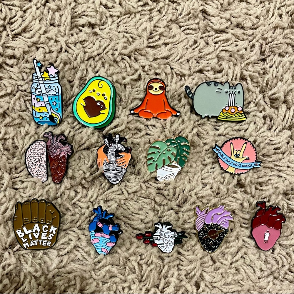 14 assorted enamel pins